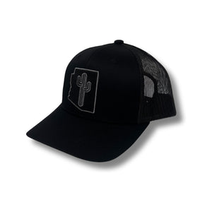 Front view of Local Stated BA Cactus Stated Hat in Black/Black featuring a tonal black cactus logo patch on a structured crown with a curved brim