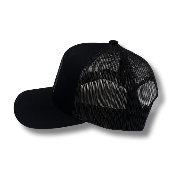 Side view of Local Stated BA Cactus Stated Hat in Black/Black showing subtle stitching, curved brim, and mid-profile fit