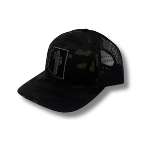 Front view of Local Stated Blacked Out Cactus Stated Hat in Black Camo featuring a tonal embroidered cactus patch on a structured camo crown with a curved brim