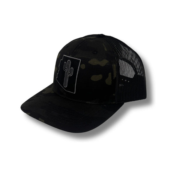 Front view of Local Stated Blacked Out Cactus Stated Hat in Black Camo featuring a tonal embroidered cactus patch on a structured camo crown with a curved brim