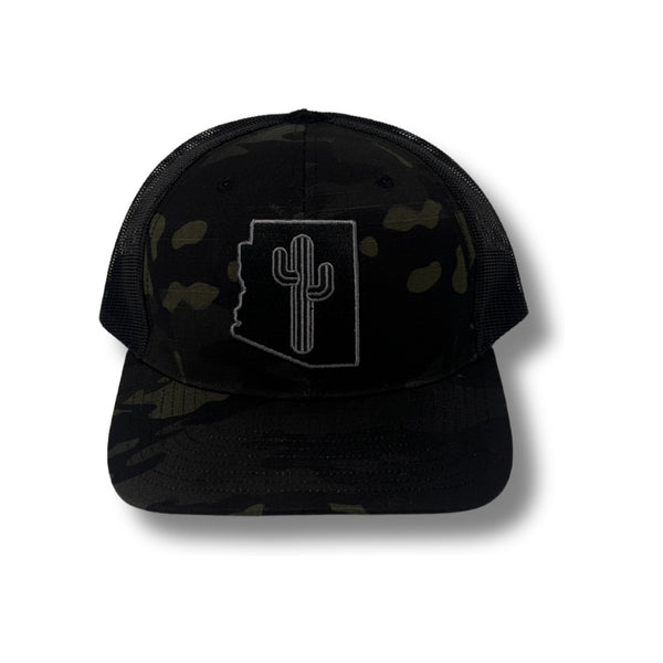 Front view of Local Stated Blacked Out Cactus Stated Hat in Black Camo featuring a tonal embroidered cactus patch on a structured camo crown with a curved brim
