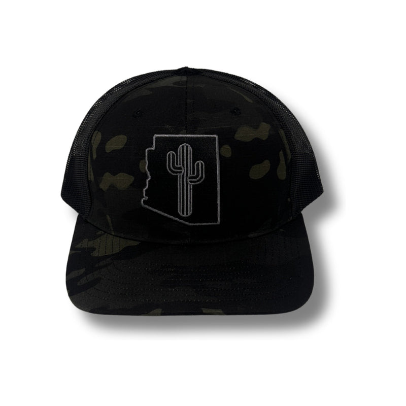 Front view of Local Stated Blacked Out Cactus Stated Hat in Black Camo featuring a tonal embroidered cactus patch on a structured camo crown with a curved brim