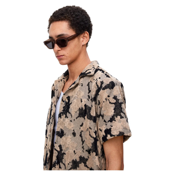 Close-up of the contrast panel seams and terry fabric texture on the OAS Cuba Terry Shirt in Jura Contraste