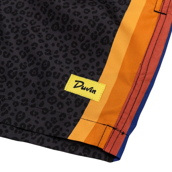 Close-up of black cat print, waistband stitching, and soft swim fabric on the Duvin Black Cat Swim Short in Black