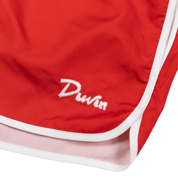 Close-up of waistband stitching, fabric texture, and bright red color on the Duvin Poolside Tanning Swim Short