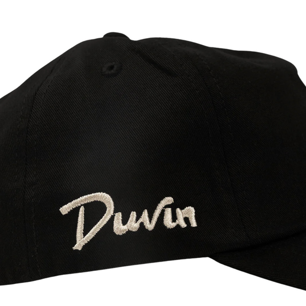 Close-up of embroidered shark detail and fabric texture on the Duvin Shark Bite Hat in Black