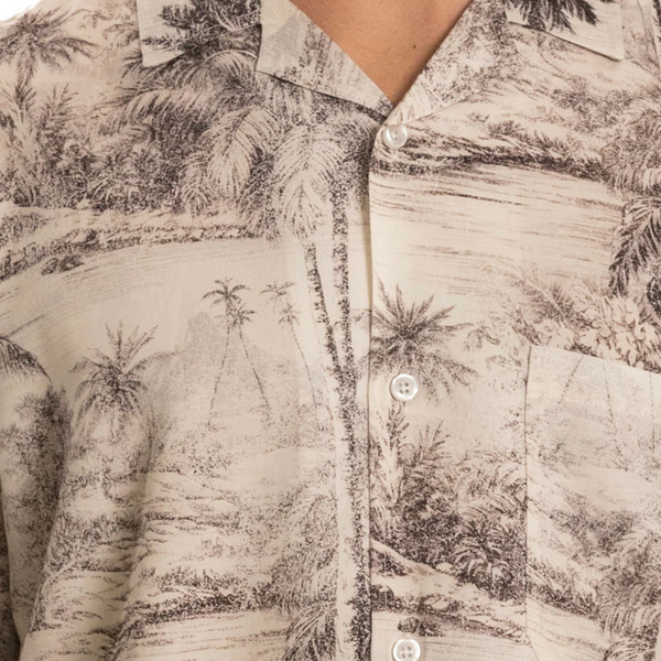 Close-up of tropical camo print, button placket, and collar detail on the Duvin Tropical Camo Button-Up