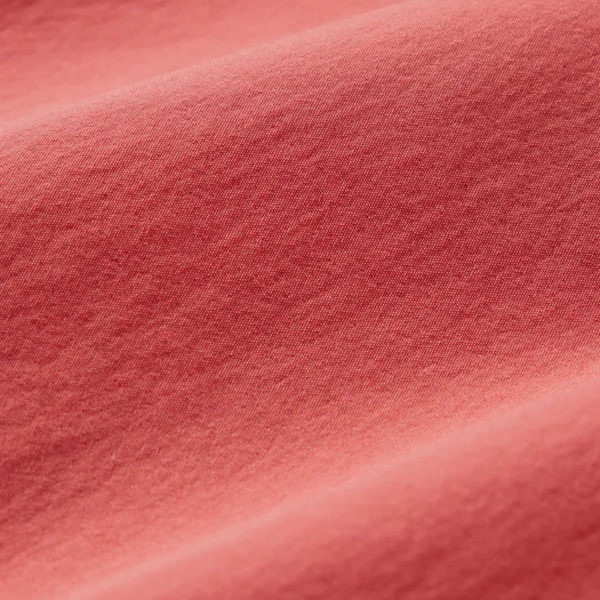 Close-up of fabric texture, drawstring, and stitching on the Fair Harbor Breaker Short in Washed Red