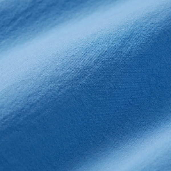 Close-up of soft performance fabric, drawstring, and stitching detail on the Fair Harbor Breaker Short in Wave Blue