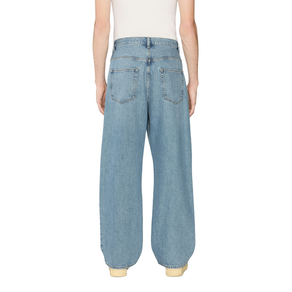 Back view of Frame Relaxed Jean in Jefferson with traditional back pockets, tonal stitching, and leather logo patch at the waistband