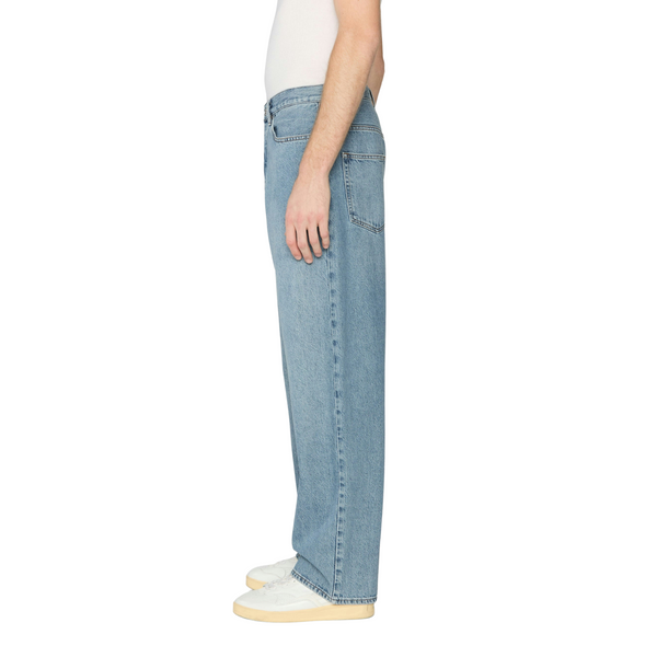 Side view of Frame Relaxed Jean in Jefferson showing clean lines, full-length straight leg, and rich denim texture
