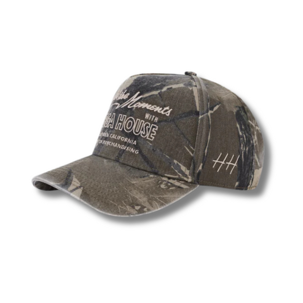 Side view of Huega House Moments Hat in Vintage Camo showing mid-profile fit, camo paneling, and breathable construction