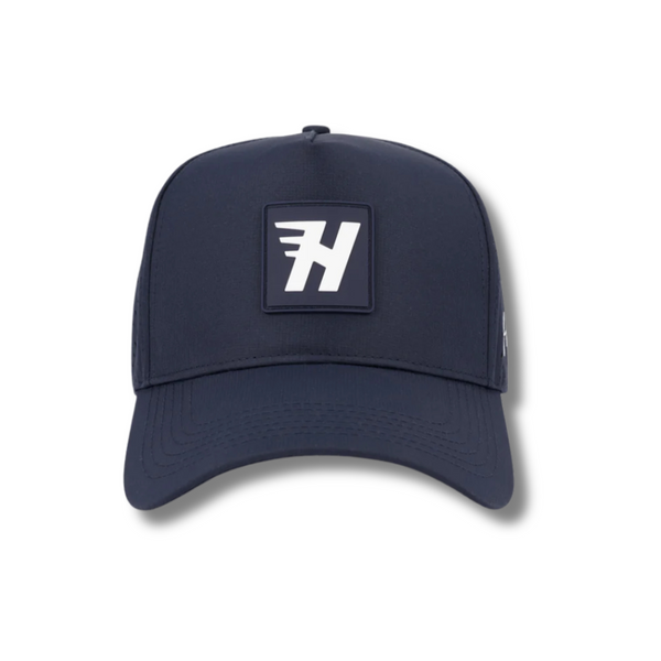 Front view of Huega House Performance Hat – Success in Navy featuring minimalist “Success” embroidery on a structured front panel with a clean, athletic look