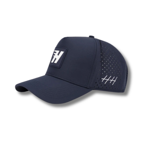 Side view of Huega House Success Performance Hat in Navy showing curved brim, sleek profile, and breathable performance mesh fabric