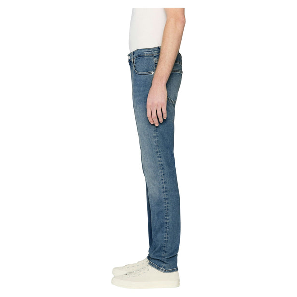 Side view of Frame Jetson Modern Straight Jeans in La Mirada showing light fading along the thigh, modern straight fit, and subtle whiskering