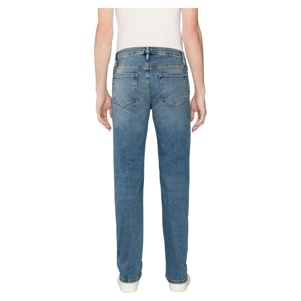 Back view of Frame Jetson Modern Straight Jeans in La Mirada with minimalist rear pockets, tonal stitching, and a leather logo patch at the waistband