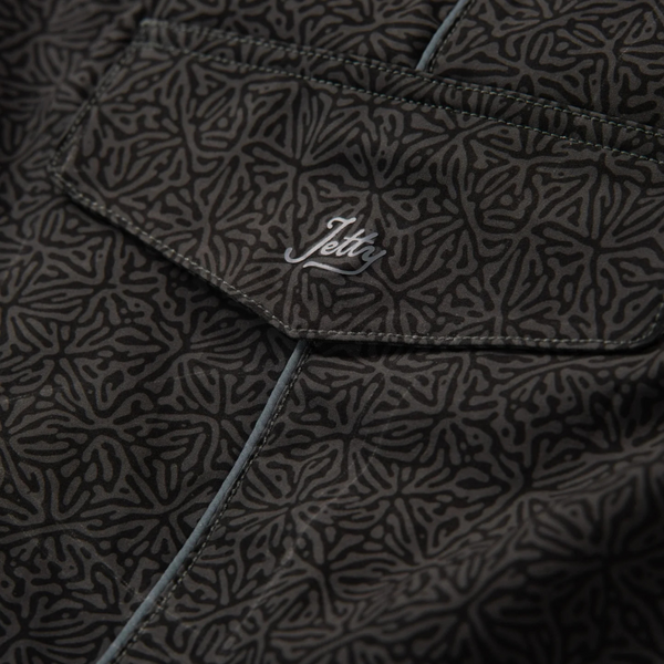 Close-up of waistband, stitching, and quick-dry fabric on the Jetty Holgate Boardshort in black