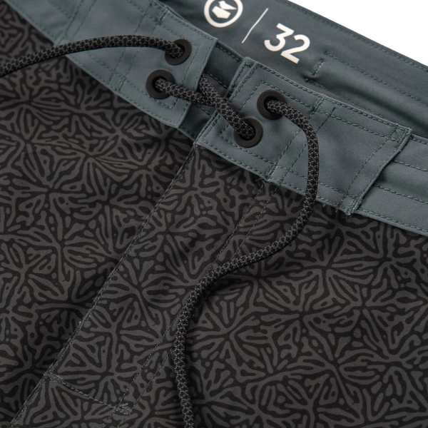Flat lay of Jetty Holgate Boardshort in black displaying front lace-up closure and technical fabric