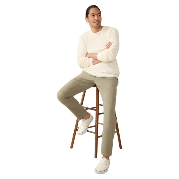 Person wearing the Faherty Linen Drawstring Pant in Canyon Olive in a relaxed, outdoor or travel setting