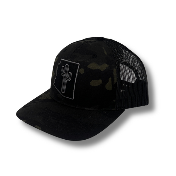 Front view of Local Stated Blacked Out Cactus Stated Hat in Black Camo featuring a tonal embroidered cactus patch on a structured camo crown with a curved brim