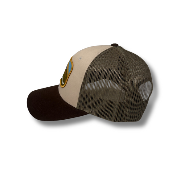 Side view of Painted Desert Hat in Tan/Brown/Green showing color-blocked brim and mesh panels for breathability and contrast style