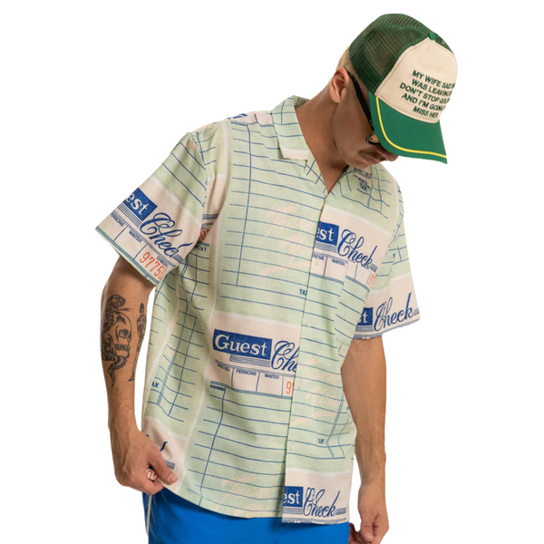 Person wearing the green Miss Trucker Hat styled casually in an outdoor setting