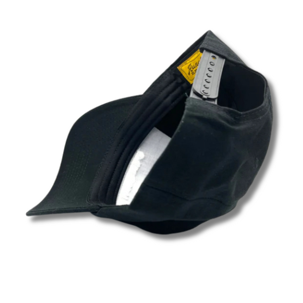 Flat lay of Ranchero Revival Gallop Hat in black showing front horse patch and classic trucker structure