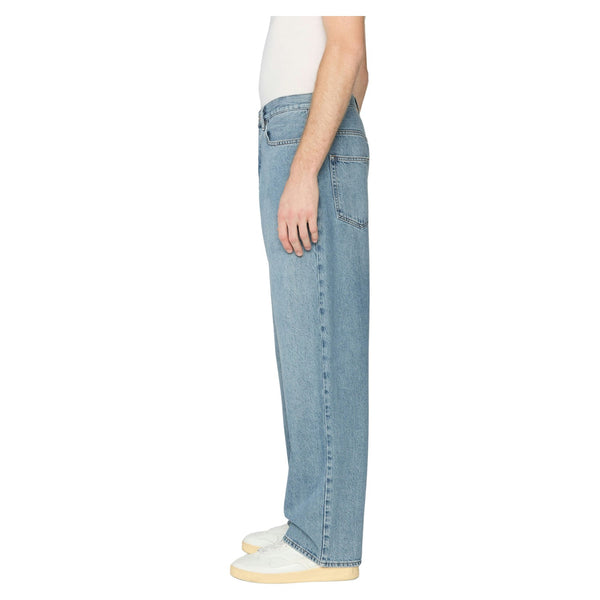Side view of Frame Relaxed Jean in Jefferson showing clean lines, full-length straight leg, and rich denim texture