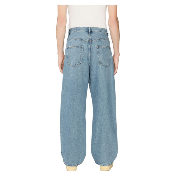 Back view of Frame Relaxed Jean in Jefferson with traditional back pockets, tonal stitching, and leather logo patch at the waistband