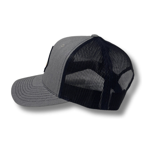 Side view of Retro Pine Hat in Heather Grey/Navy showing the contrast brim, breathable mesh back, and clean panel construction