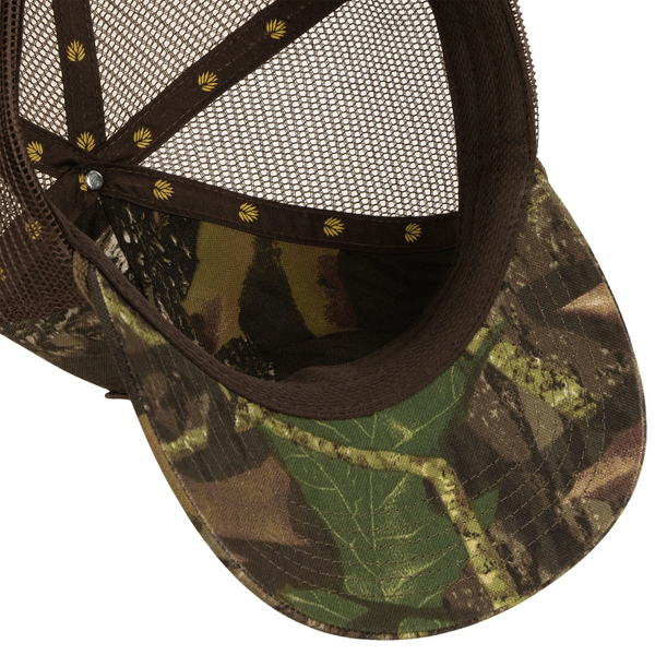 Flat lay of Sendero Country Store Hat in camo highlighting embroidered patch, camo fabric, and structured front panel