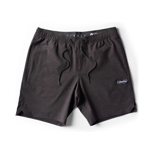 Flat lay of Vissla Solid Sets Ecolastic Boardshort in Black showcasing the elastic waistband, drawstring, and soft eco-conscious fabric