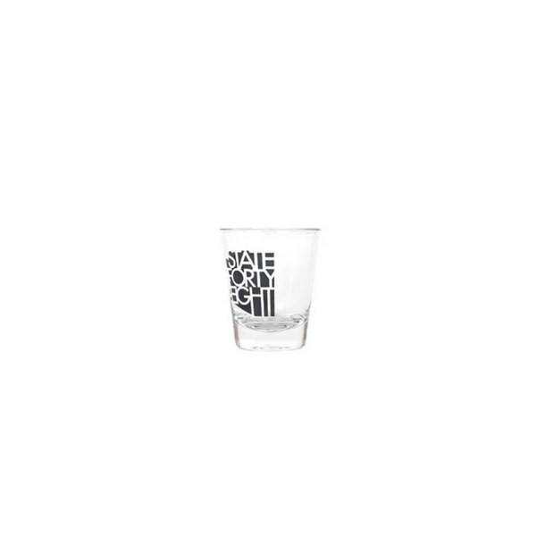 Side view of State Forty Eight Shot Glass Classic in Black showing compact size and bold logo placement