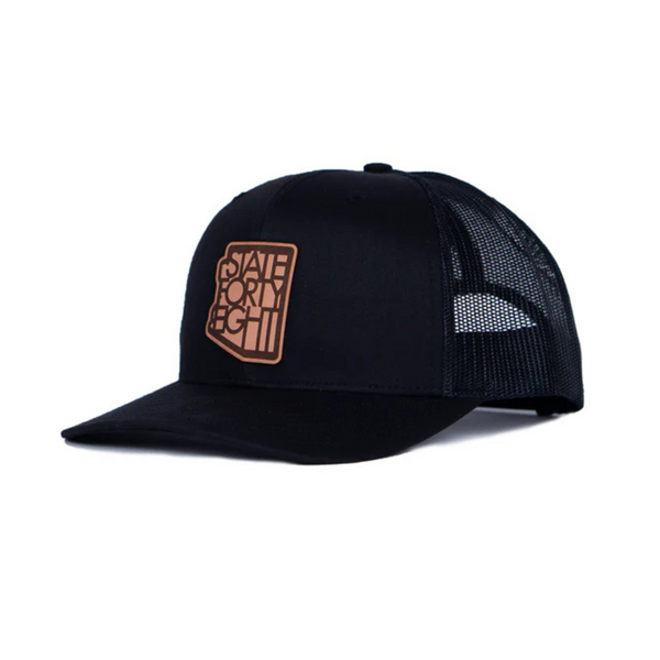 Side view of State Forty Eight Classic Snapback in Black & Brown showing contrast brown curved brim and mesh back panel