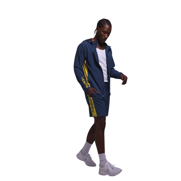 Side view of Tenore Flow Team Short in navy showing sleek side pocket and breathable construction for active wear