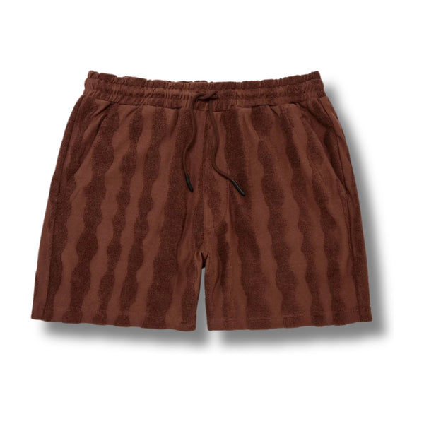 Flat lay of OAS Totem Terry Shorts highlighting vibrant pattern, terry texture, and drawstring waistband