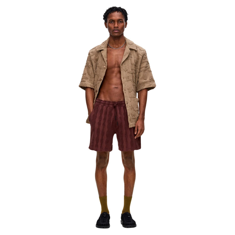 Front view of OAS Totem Terry Shorts featuring elastic waistband, drawstring closure, and soft terry fabric with a bold totem-inspired pattern