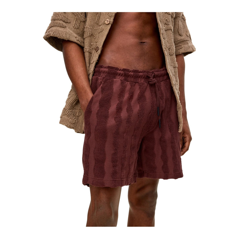Side view of OAS Totem Terry Shorts showing relaxed fit, side pocket, and plush textured fabric