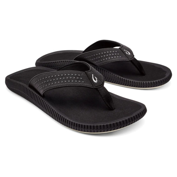 Front view of OluKai Ulele sandals in black featuring water-friendly straps and cushioned footbed