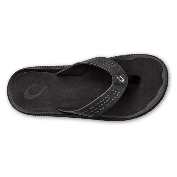 Top view of black OluKai Ulele sandals displaying textured straps and anatomical footbed design