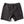Flat lay of Vissla Solid Sets Ecolastic Boardshort in Black showcasing the elastic waistband, drawstring, and soft eco-conscious fabric