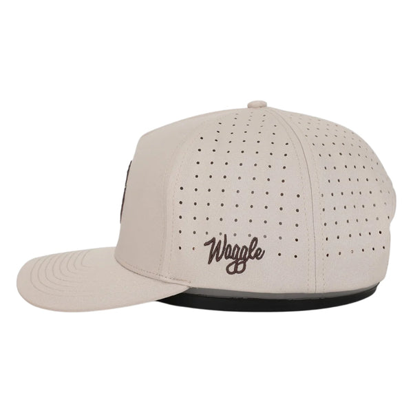 Side view of Waggle Wally Hat in Tan showing breathable mesh side panels, performance fit, and mid-profile shape